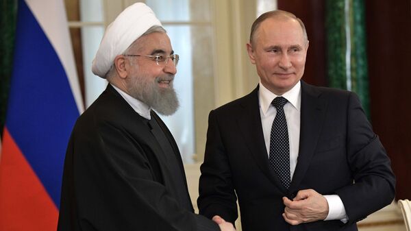 Президент РФ Владимир Путин и президент Исламской Республики Иран Хасан Роухани. Архивное фото