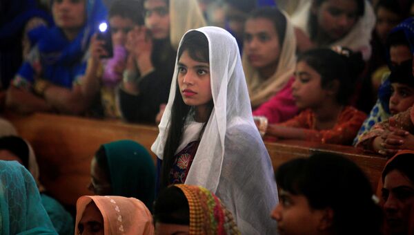 Девочка на пасхальной мессе в Исламабаде, Пакистан
