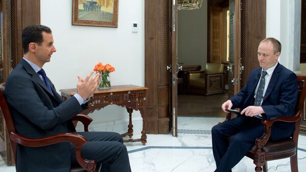 Президент Сирии Башар Асад и заместитель главного редактора МИА Россия сегодня Дмитрий Горностаев во время интервью