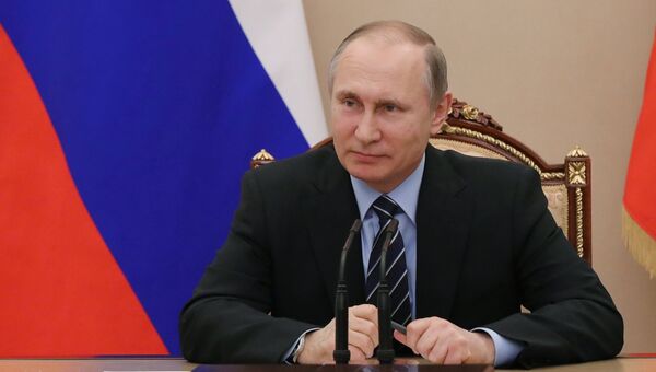 Президент России Владимир Путин на совещании в Совете безопасности РФ. Архивное фото