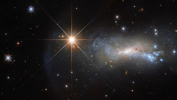 На этом снимке Хаббла галактику NGC 7250 почти не видно из-за яркой звезды TYC 3203-450-1