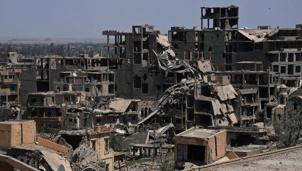 Разрушенные здания в сирийском городе Дейр-эз-Зор. Архивное фото