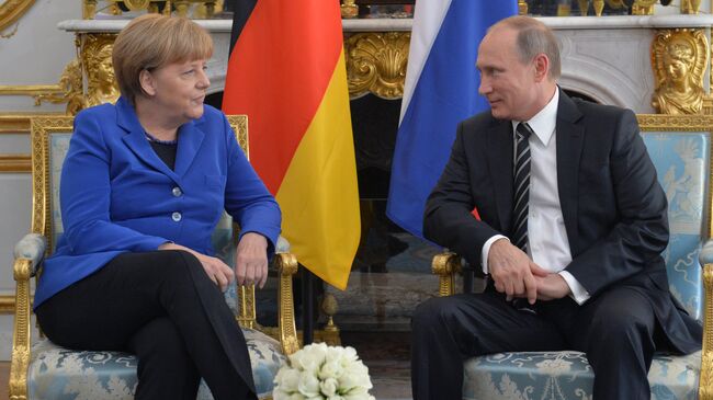 Президент России Владимир Путин и канцлер Федеративной Республики Германия Ангела Меркель во время встречи