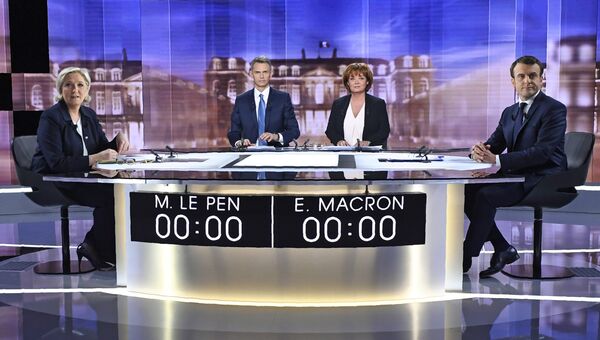 Кандидаты в президенты Франции — основатель движения Вперед Эммануэль Макрон и лидер партии Национальный фронт Марин Ле Пен на теледебатах