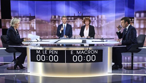 Кандидаты в президенты Франции Эммануэль Макрон и Марин Ле Пен. Архивнео фото