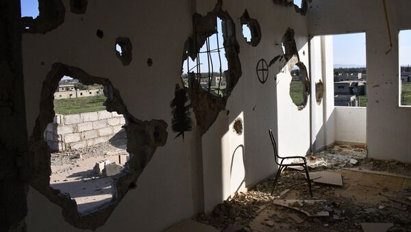 Здания, разрушенные в результате боевых действий в пригороде Дамаска Восточная Гута. Архивное фото