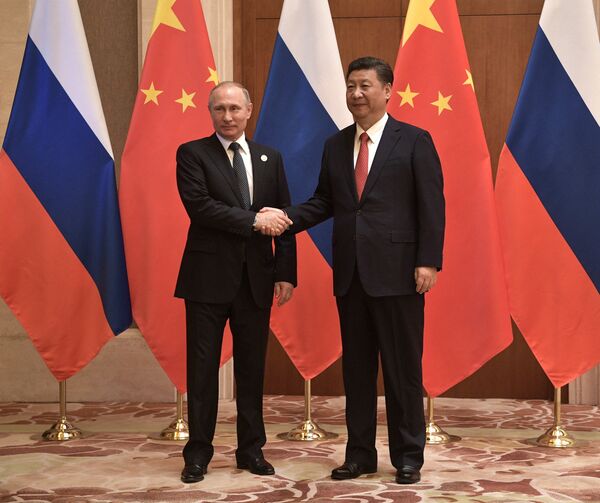 Президент РФ Владимир Путин и председатель КНР Си Цзиньпин во время российско-китайских переговоров в рамках Международного форума Один пояс, один путь. 14 мая 2017
