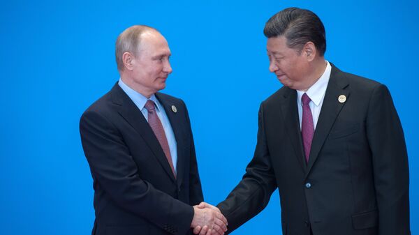 Президент РФ Владимир Путин и председатель Китайской Народной Республики Си Цзиньпин во время форума Один пояс, один путь в Пекине. 15 мая 2017