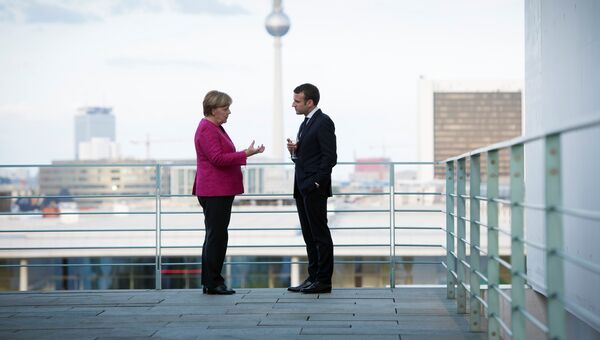 Канцлер Германии Ангела Меркель и президент Франции Эммануэль Макрон во время встречи в Берлине. 15 мая 2017