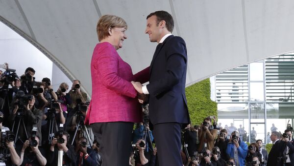 Канцлер Германии Ангела Меркель и президент Франции Эммануэль Макрон во время встречи в Берлине, 15 мая 2017