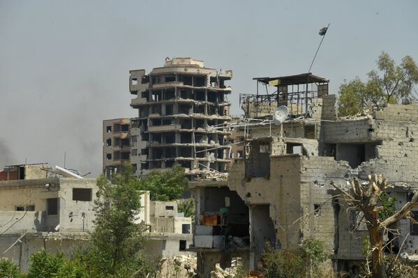 Разрушенные здания в квартале Кабун в пригороде Дамаска