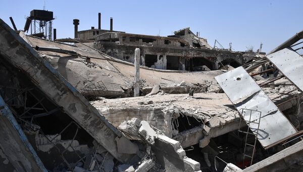 Разрушенные здания в квартале Кабун в пригороде Дамаска