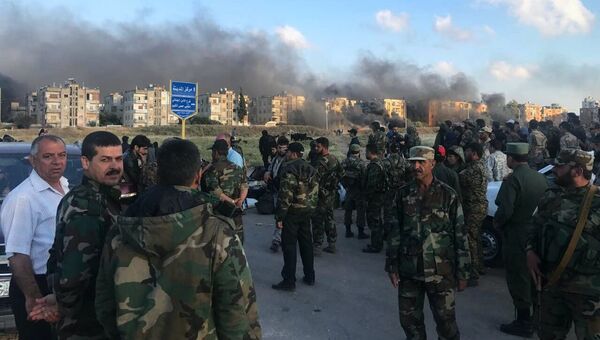 Последний этап вывода боевиков из квартала Аль-Ваэр в городе Хомс. 21 мая 2017