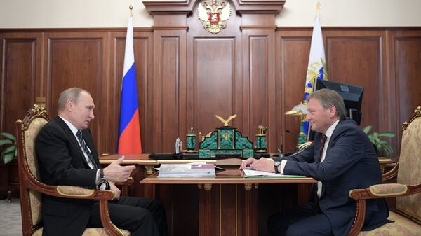 Президент РФ Владимир Путин и уполномоченный при президенте РФ по защите прав предпринимателей Борис Титов во время встречи. 26 мая 2017
