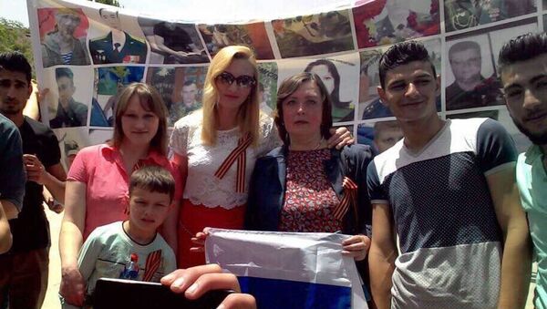 Акция Бессмертный полк с портретами погибших в Сирии российских военнослужащих в Хомсе
