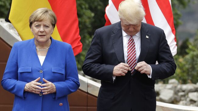 Ангела Меркель и Дональд Трамп во время саммита G7 в Таормине, Италия. 26 мая 2017