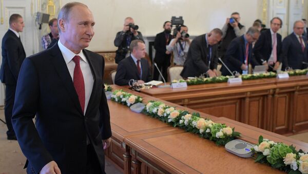 Встреча президента РФ Владимира Путина с руководителями международных информационных агентств на Петербургском экономическом форуме