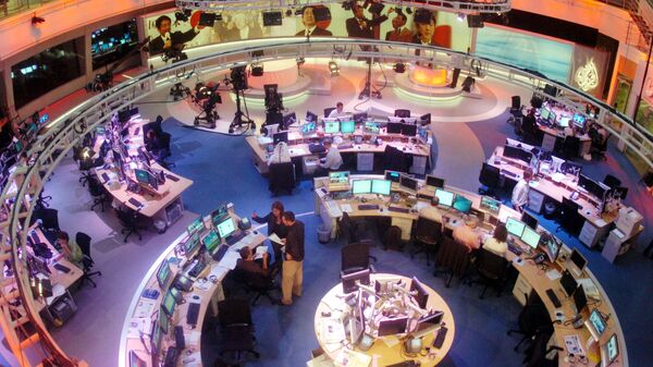 Сотрудники в офисе телекомпании Al Jazeera в Дохе, Катар. Архивное фото