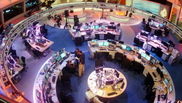 Сотрудники в офисе телекомпании Al Jazeera в Дохе, Катар