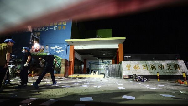 Криминалисты на месте взрыва в детском саду в провинции Цзянсу в Китае