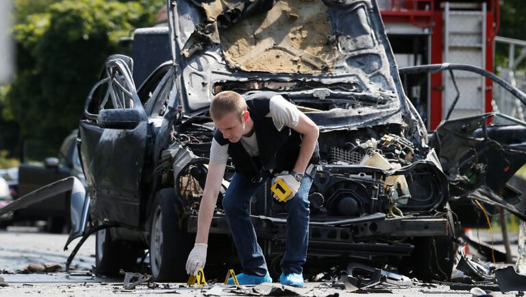 Автомобиль Mercedes в Соломенском районе Киева после взрыва. 27 июня 2017