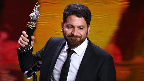 Турецкий режиссер Фикрет Рейхан, получивший награду в номинации Лучший режиссер, на церемонии закрытия 39-го Московского международного кинофестиваля