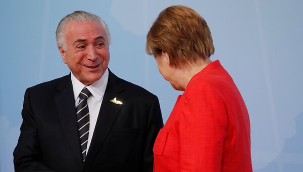 Президент Бразилии Мишел Темер и канцлер ФРГ Ангела Меркель в первый день саммита G-20 в Гамбурге