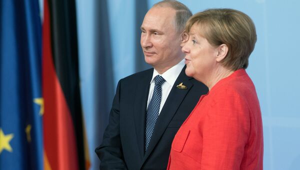 Президент РФ Владимир Путин и канцлер Германии Ангела Меркель принимают участие в саммите Группы двадцати в Гамбурге. 7 июля 2017
