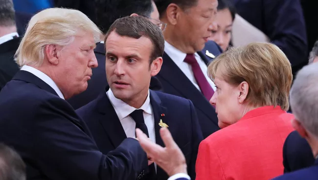 Президент США Дональд Трамп, президент Франции Эммануэль Макрон и федеральный канцлер Германии Ангела Меркель. Архивное фото