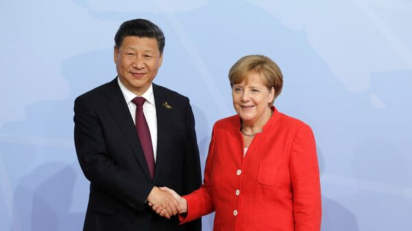  Председатель Китайской Народной Республики Си Цзиньпин и канцлер Германии Ангелой Меркель на саммите G20 в Гамбурге