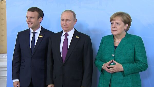 Путин, Меркель и Макрон фотографировались перед рабочим завтраком на G20. Архивное фото