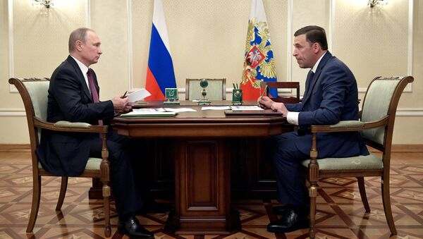 Президент Владимир Путин и врио губернатора Свердловской области Евгений Куйвашев во время встречи. 9 июля 2017