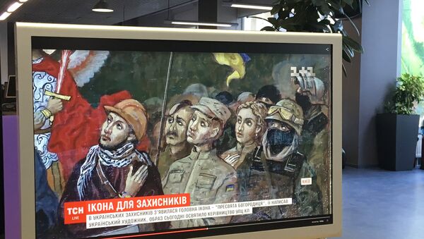 Сюжет украинского телеканала 1+1 об иконе с изображением участников майдана на экране монитора