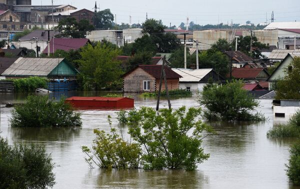 Здания, затопленные в результате наводнения, в Уссурийске