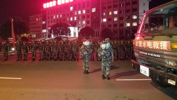 Китайская полиция в юго-западной провинции Сычуань. 8 августа 2017