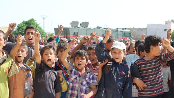 Дети в поселении Арран на севере-востоке Алеппо