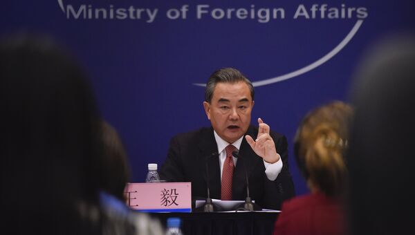 Министр иностранных дел Китая Ван И во время пресс-конференции в Пекине. 30 августа 2017