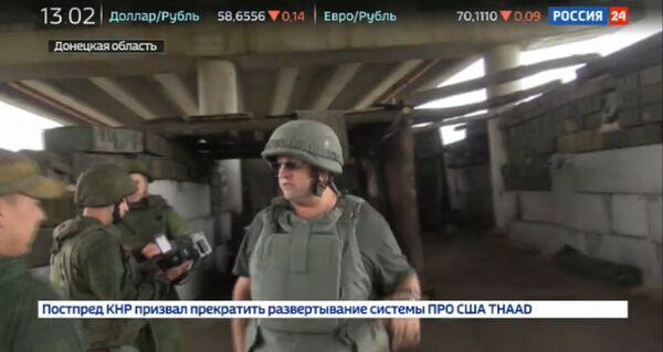Стоп-кадр репортажа об обстреле съемочной группы телеканала Россия 24 Стоп-кадр репортажа об обстреле съемочной группы телеканала Россия 24
