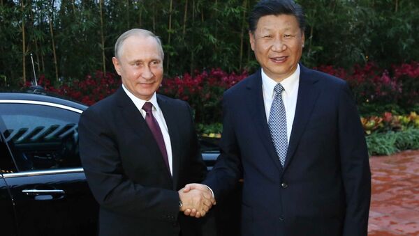 Владимир Путин и председатель КНР Си Цзиньпин во время встречи на полях саммита БРИКС в Сямэне. 3 сентября 2017