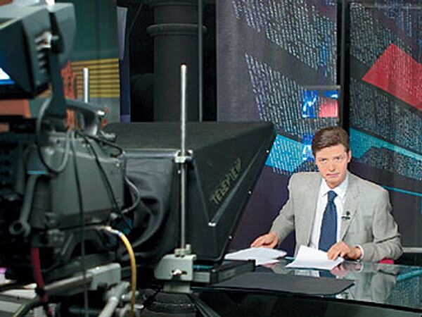 Алексей Воробьев ведет новости RTVi
