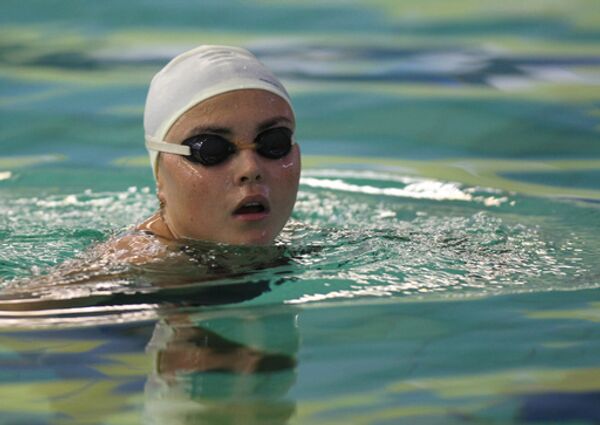 Чемпионка мира Лариса Ильченко во время тренировки на спортбазе Озеро Круглое
