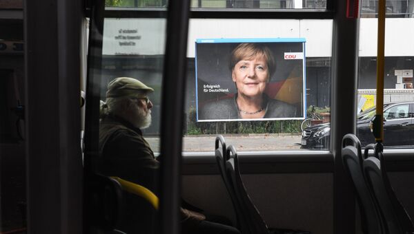 Плакат с изображением канцлера Германии накануне парламентских выборов в Германии. 23 сентября 2017
