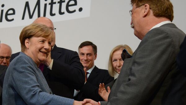 Канцлер Германии, лидер Христианско-демократического союза Ангела Меркель во время парламентских выборов в Берлине