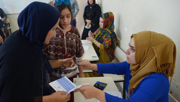 Жители на избирательном участке в городе Эрбиль во время референдума о независимости Иракского Курдистана. 25 сентября 2017