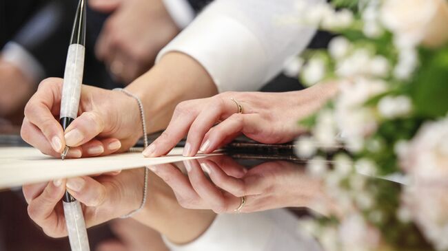 Церемония регистрации брака в ЗАГС. Архивное фото