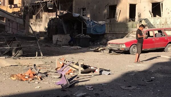 Последствия ракетного обстрела квартала Аль-Кусур в сирийском Дейр-эз-Зоре. 6 октября 2017