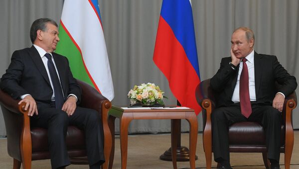 Президент РФ Владимир Путин и президент Узбекистана Шавкат Мирзиеев. Архивное фото