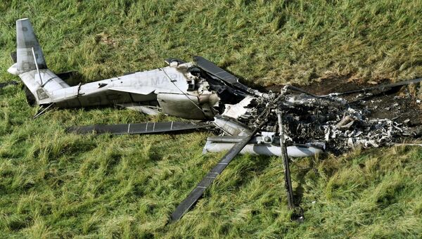 Последствия крушения транспортного вертолета США CH-53E в селе Хигаси на Окинаве в Японии