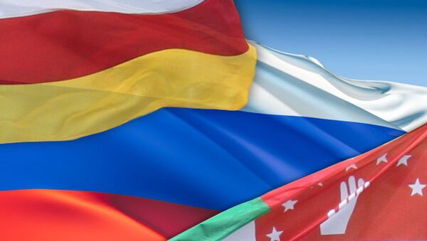 Флаги Осетии, России, Абхазии