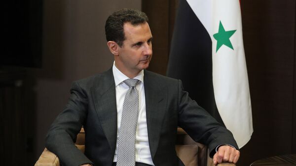 Президент Сирии Башар Асад во время встречи с президентом РФ Владимиром Путиным. Архивное фото
